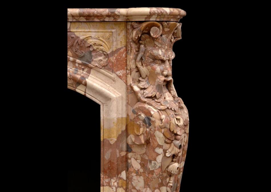 An unusual French transitional style Breche d'Alep marble fireplace