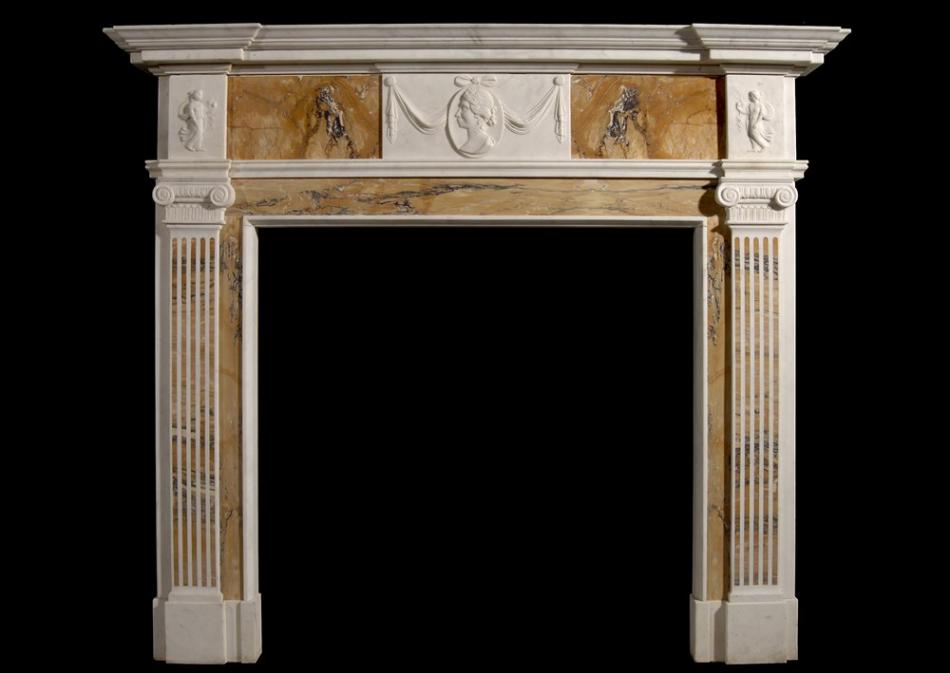 An English George III style Statuary and inlaid Siena fireplace