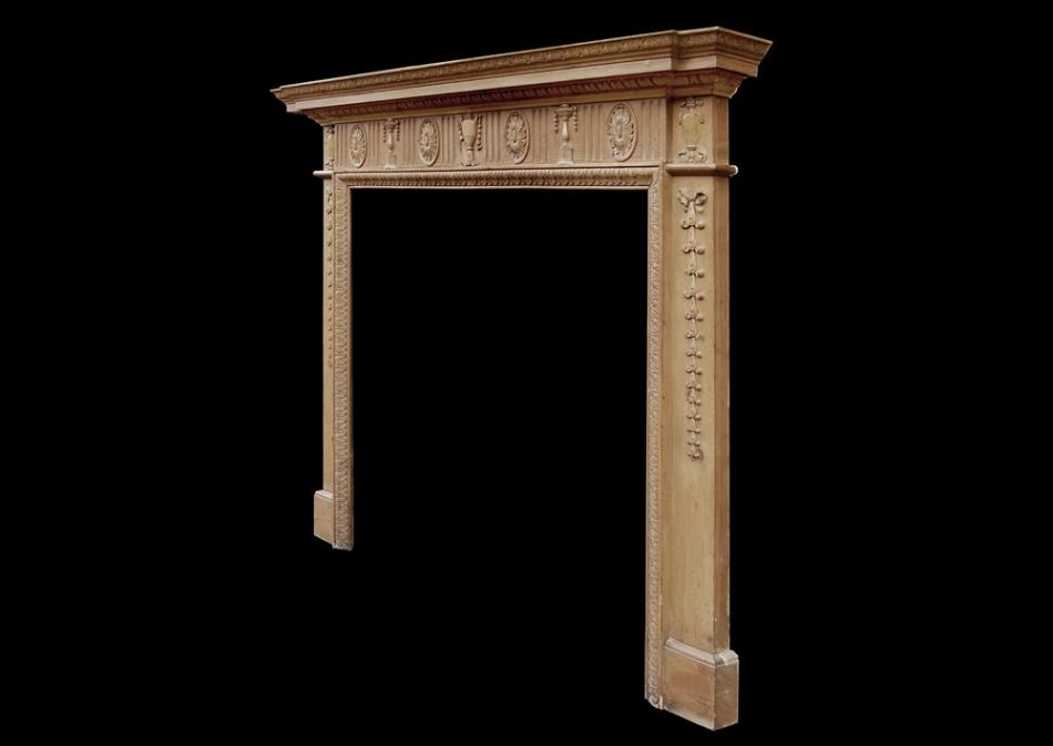 A classical English waxed pine fireplace