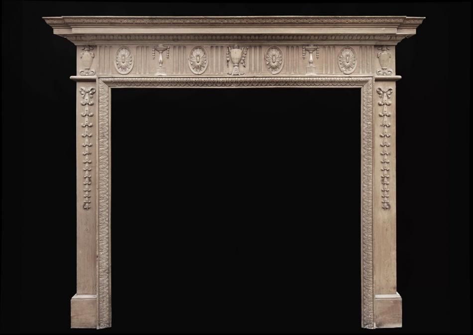 A classical English waxed pine fireplace