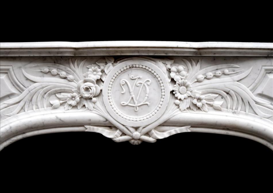 An attractive Louis XIV style Carrara marble chimneypiece