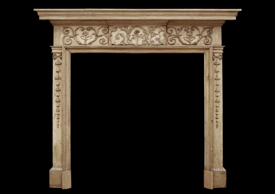 An attractive 18th century George III pine fireplace
