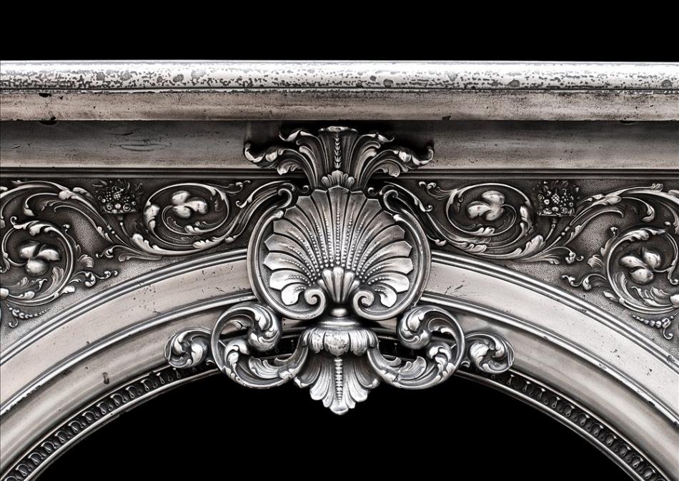 An ornate 19th century French cast iron fireplace