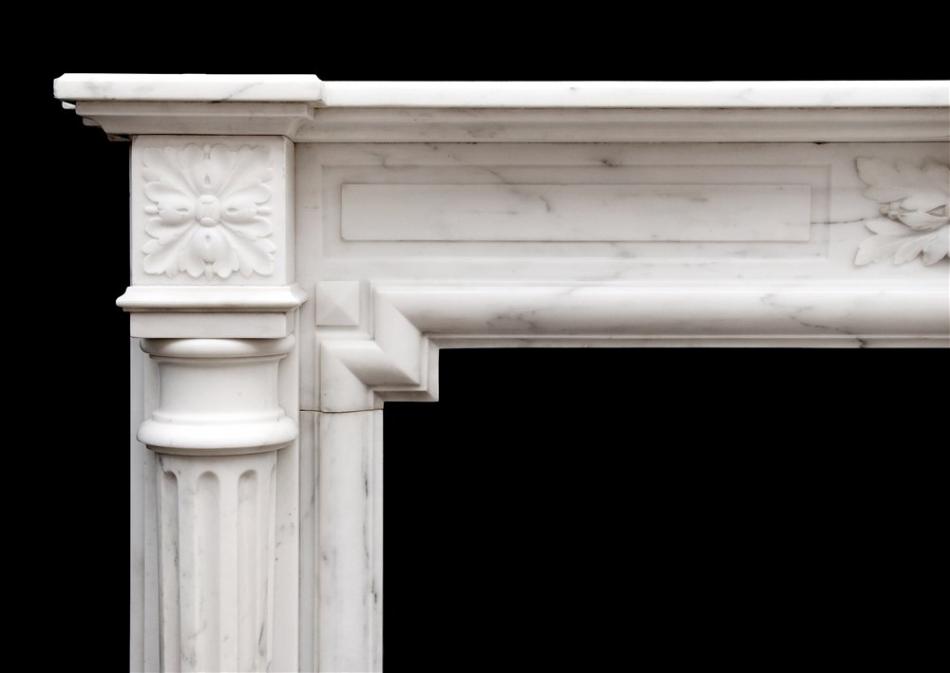 A French Louis XVI style fireplace in Statuary marble