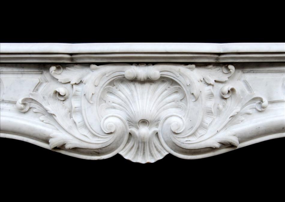 A French Carrara marble Louis XV style fireplace