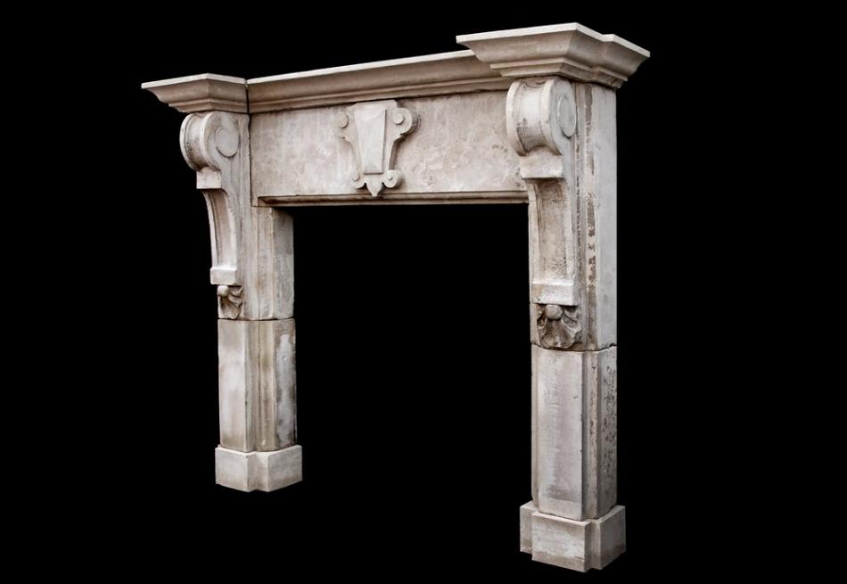 A large limestone fireplace with shaped brackets (pair available)