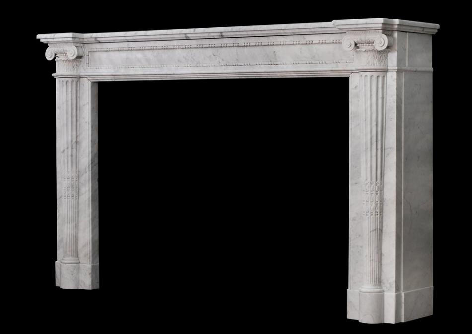 A very finely carved French Louis XVI mantlepiece in Carrara marble