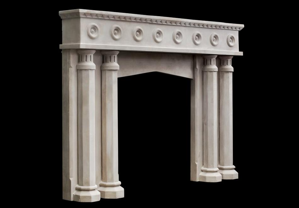 An English limestone fireplace with a gothic influence