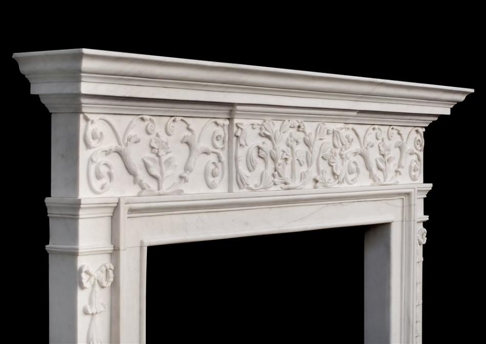 An attractive George III style white marble fireplace