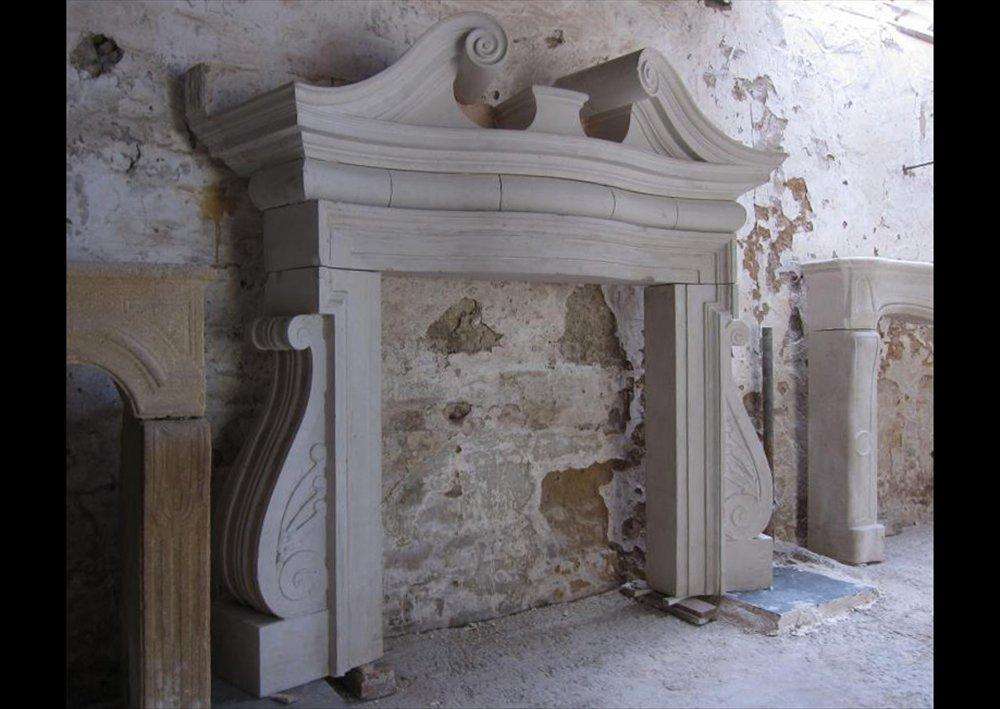 A Dramatic English Portland Stone Fireplace In The Palladian