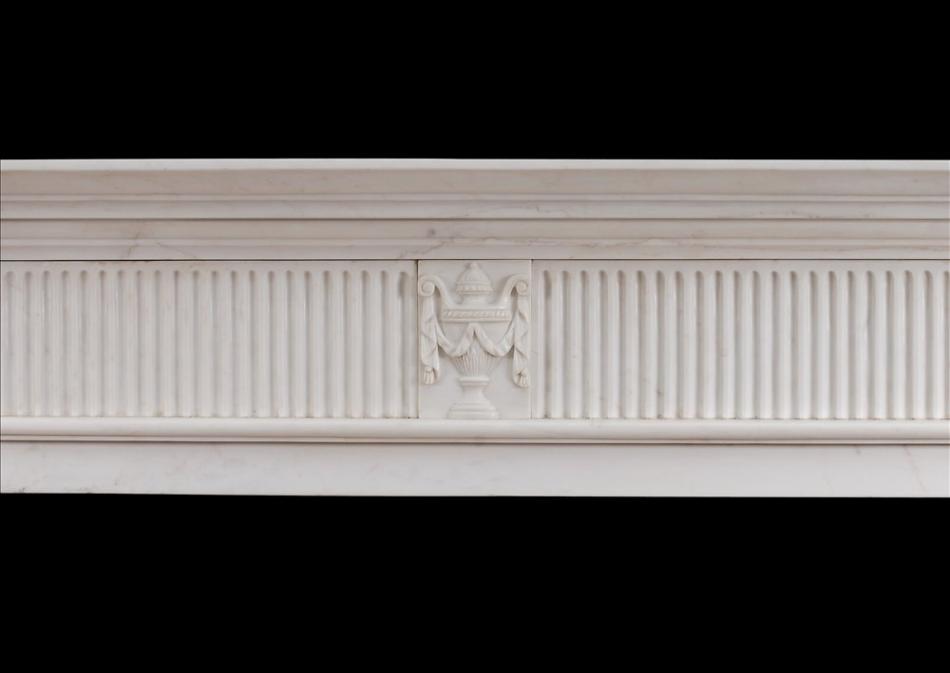 A Georgian style marble fireplace in white marble