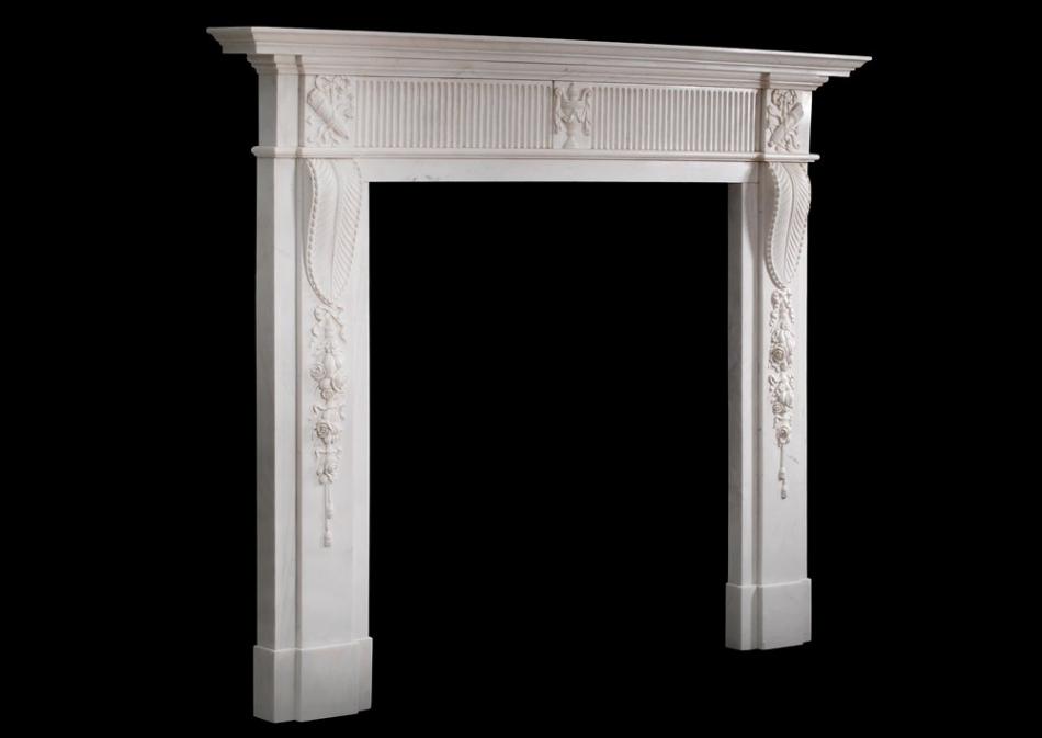 A Georgian style marble fireplace in white marble