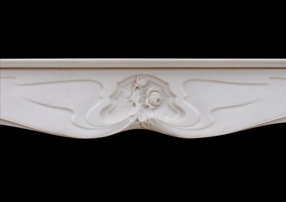 A refined French Art Nouveau white Statuary marble fireplace
