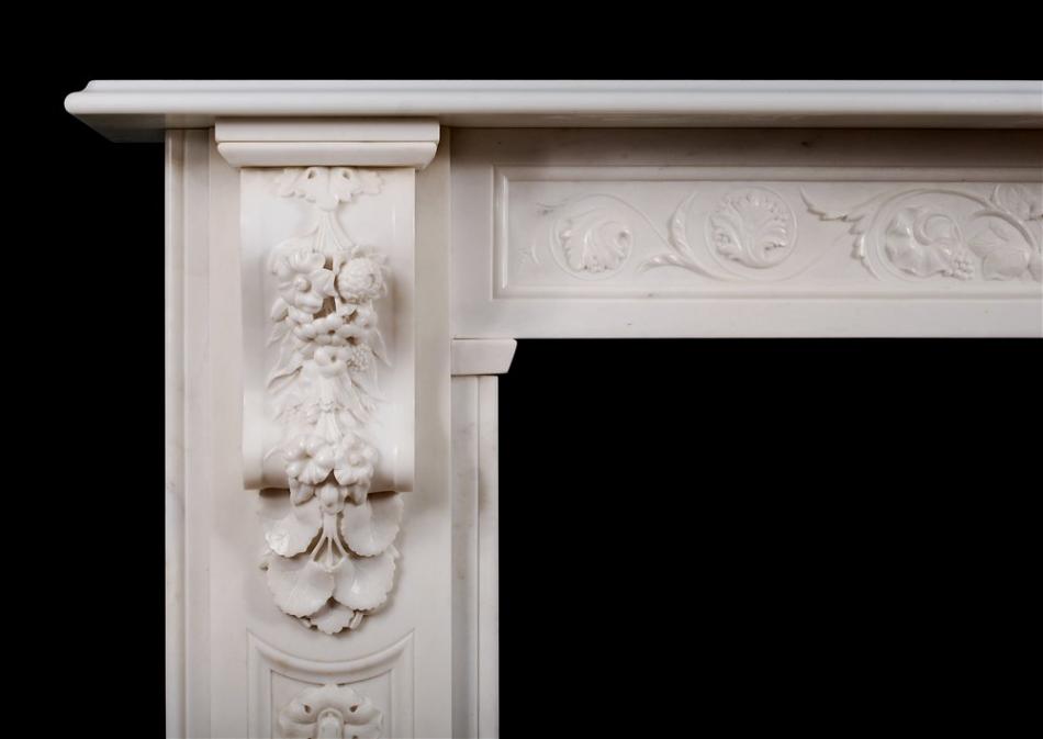 A well carved Victorian English Statuary marble fireplace