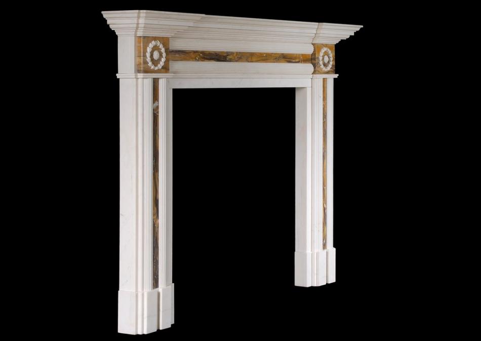 An English Regency style fireplace in white marble with Siena inlay