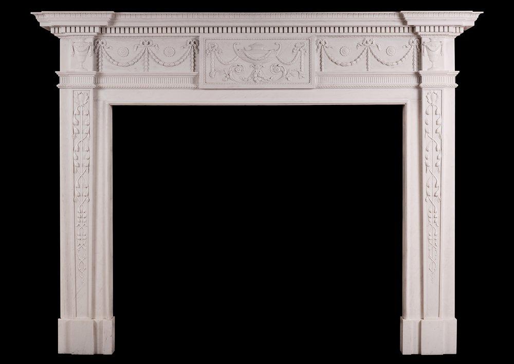 A WHITE MARBLE FIREPLACE IN THE MANNER OF ROBERT ADAM