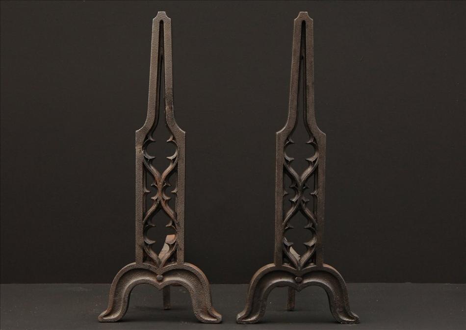 A pair of Gothic Revival cast iron firedogs