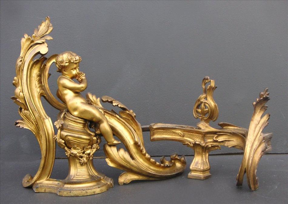 An impressive pair of 18th century Louis XV brass chenets