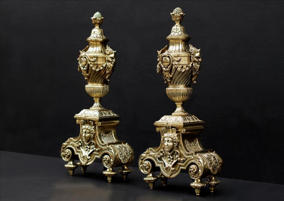 A pair of ornate brass chenets