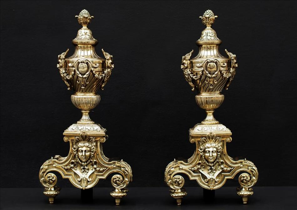 A pair of ornate brass chenets