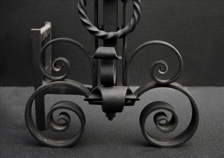 A pair of scrolled wrought iron firedogs - 11 inch