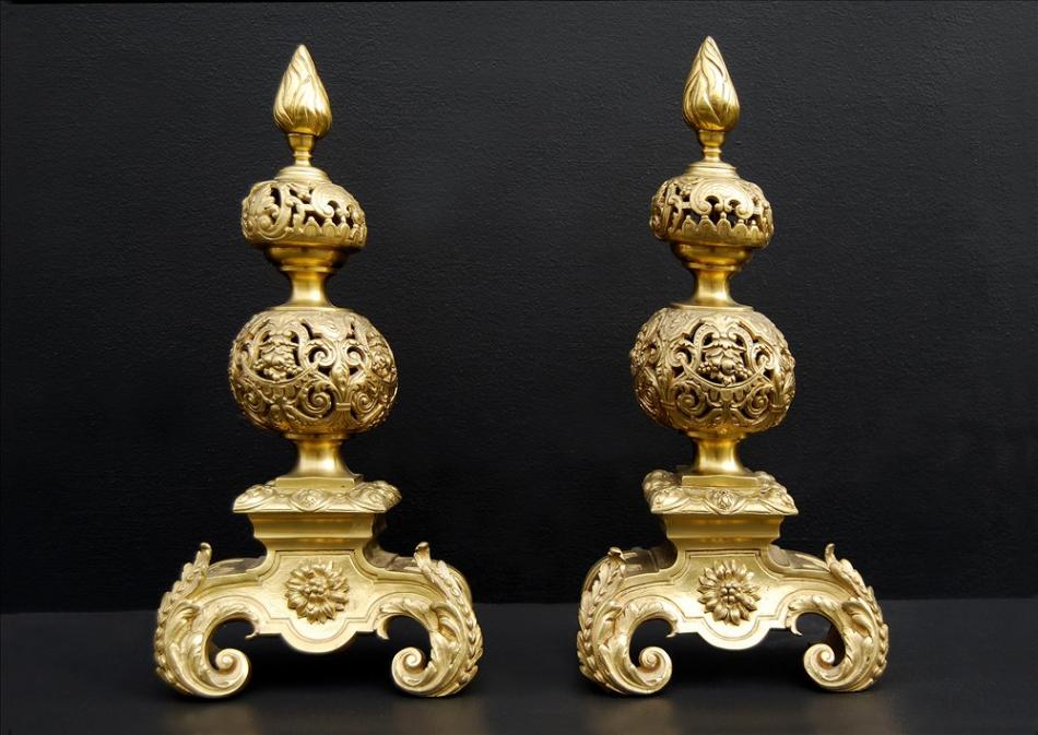 A pair of richly adorned Baroque style gilt bronze andirons