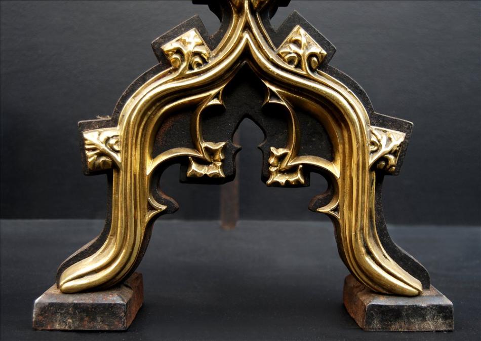 A pair of Gothic revival firedogs in the manner of Augustus Pugin