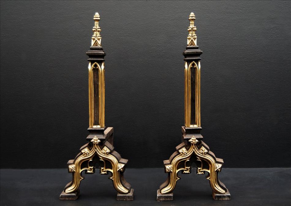 A pair of Gothic revival firedogs in the manner of Augustus Pugin