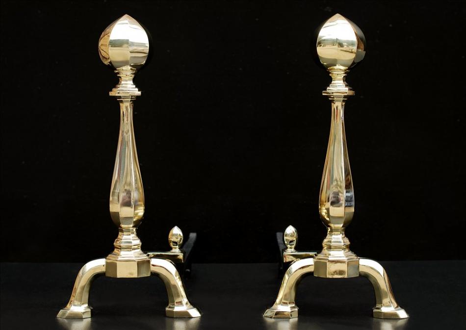 An imposing pair of brass andirons