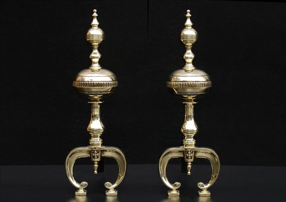 A pair of English brass firedogs