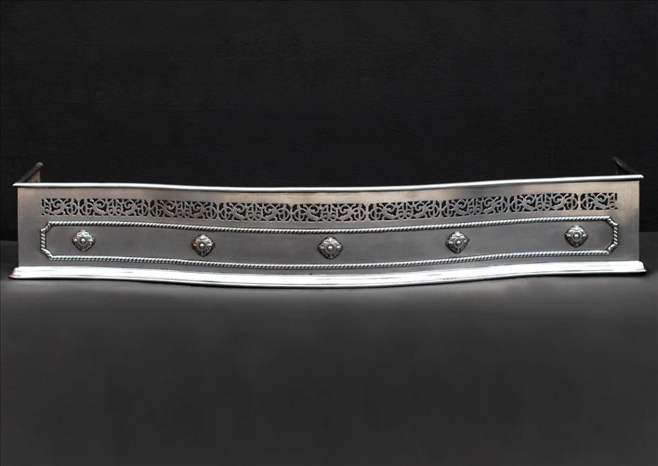 A polished steel pierced fender in the Georgian style