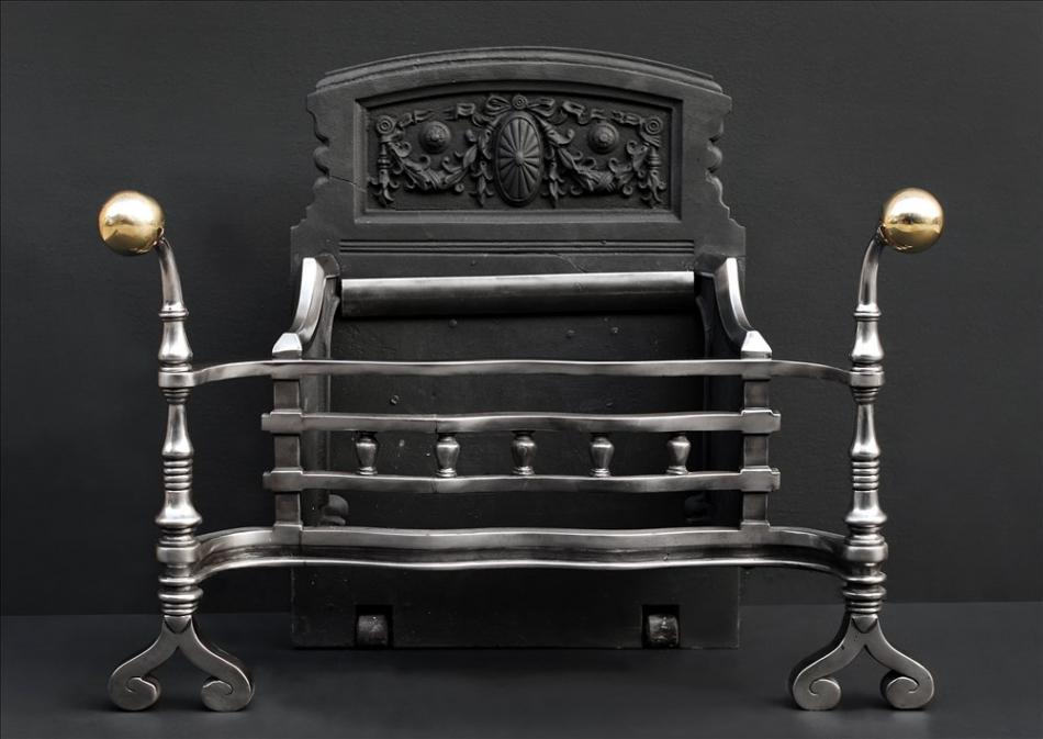 A victorian polished steel fire basket