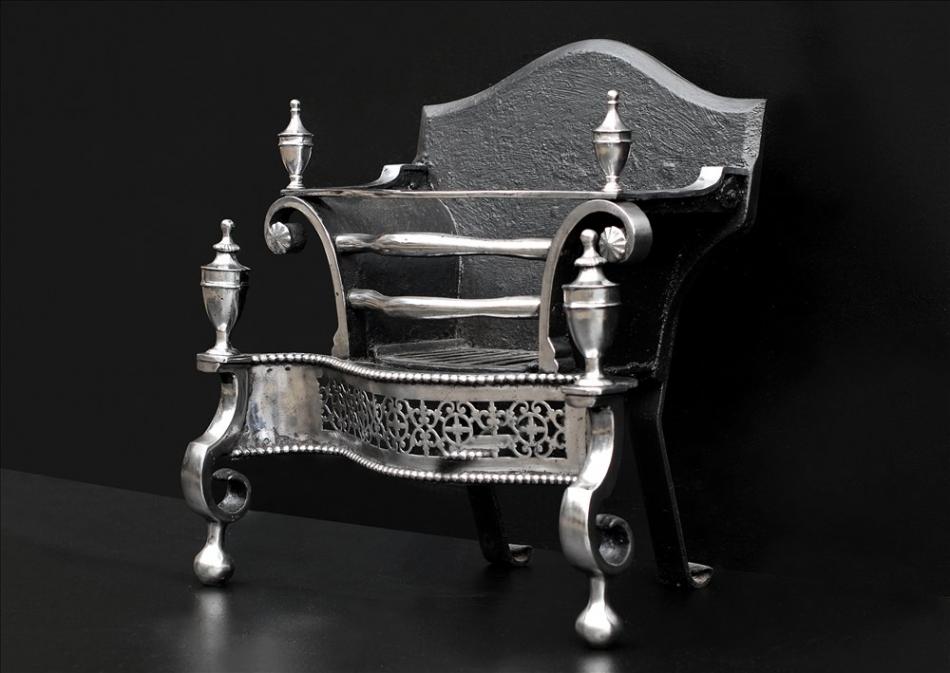 A polished steel English antique firegrate