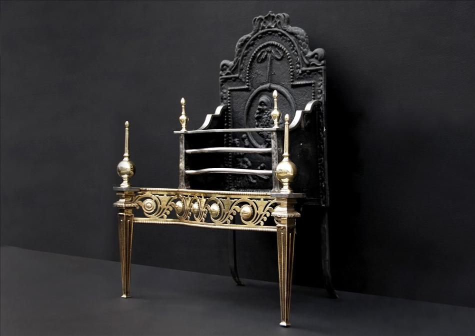 A fine quality English brass and steel firegrate with ornate fret