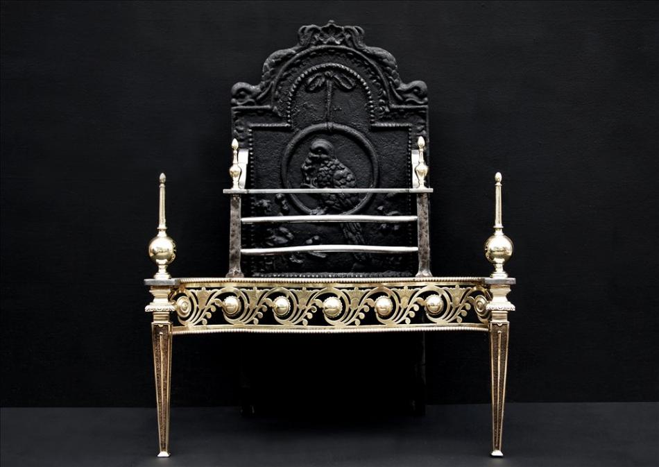 A fine quality English brass and steel firegrate with ornate fret