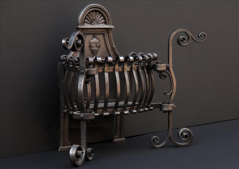 A late 19th or early 20th century Arts and Crafts wrought iron firebasket