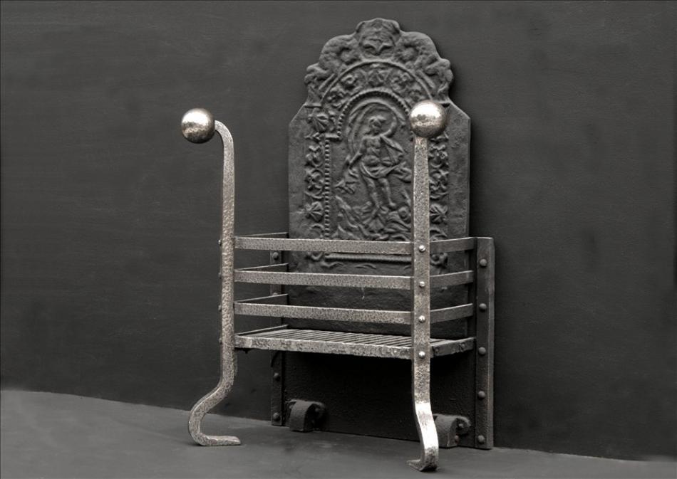 An 18th century wrought iron firegrate with decorative cast iron back