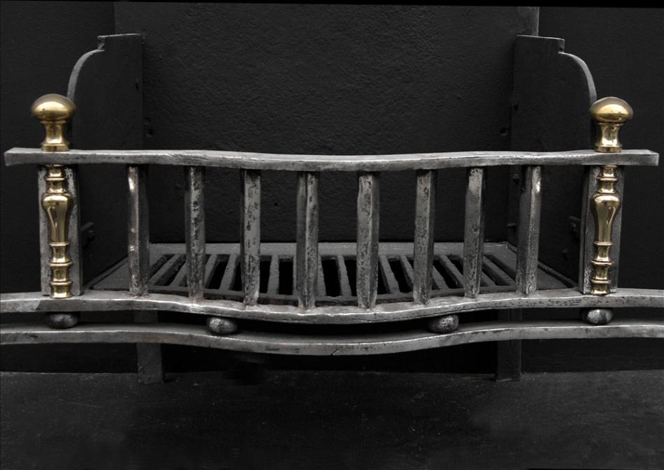 A large mid 19th century English cast iron firegrate