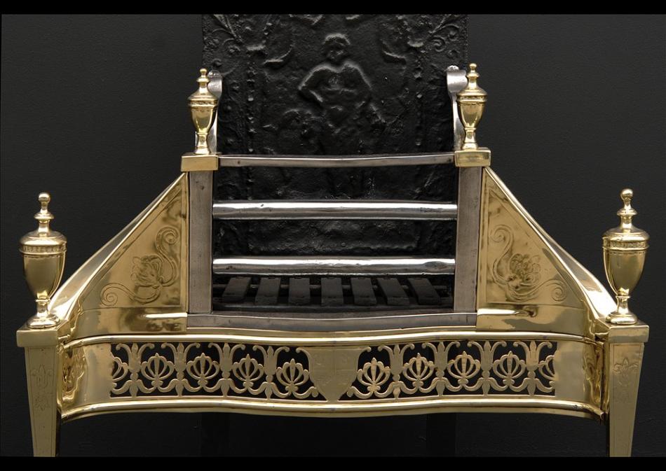 An early 19th century Georgian brass and antique steel engraved firegrate