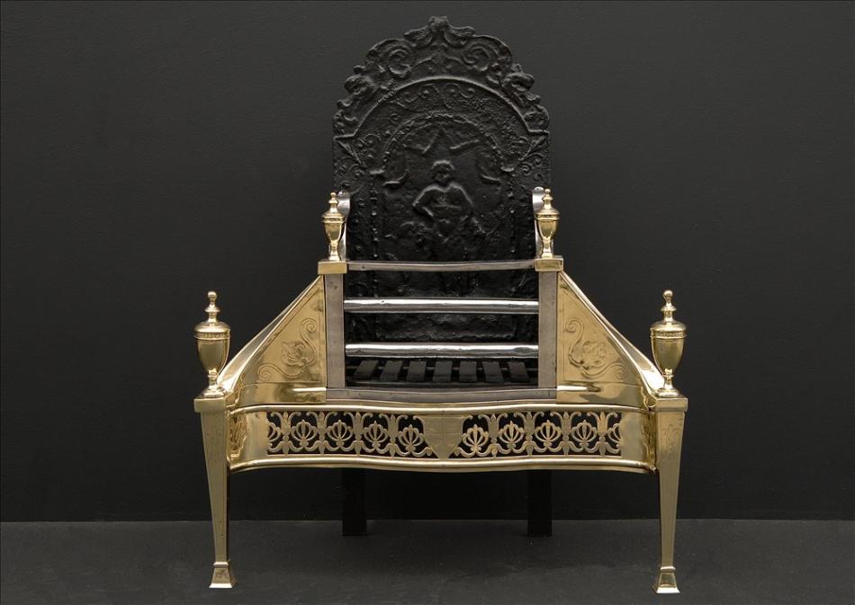 An early 19th century Georgian brass and antique steel engraved firegrate