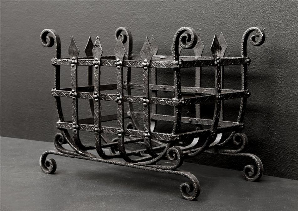 A rustic English wrought iron firegrate