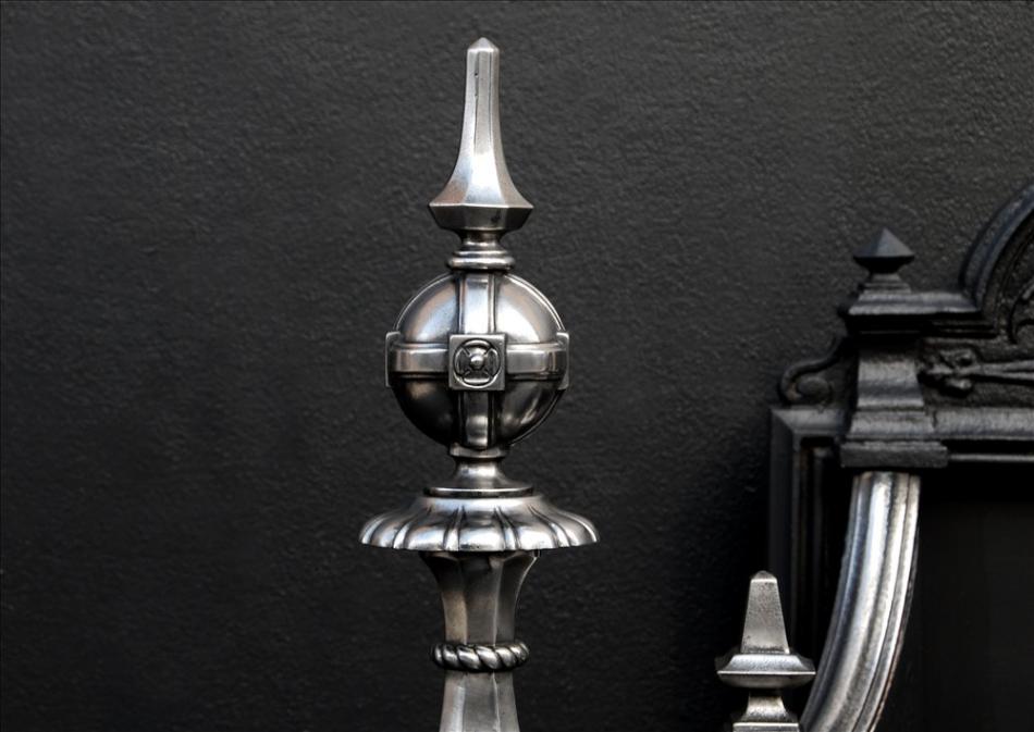 An impressive Baroque polished cast iron firegrate
