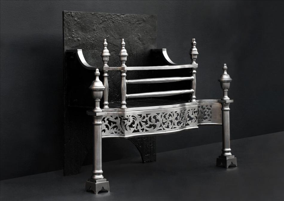 A steel firegrate in the manner of Thomas Chippendale