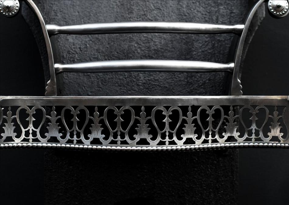 An attractive Queen Anne style polished steel firegrate