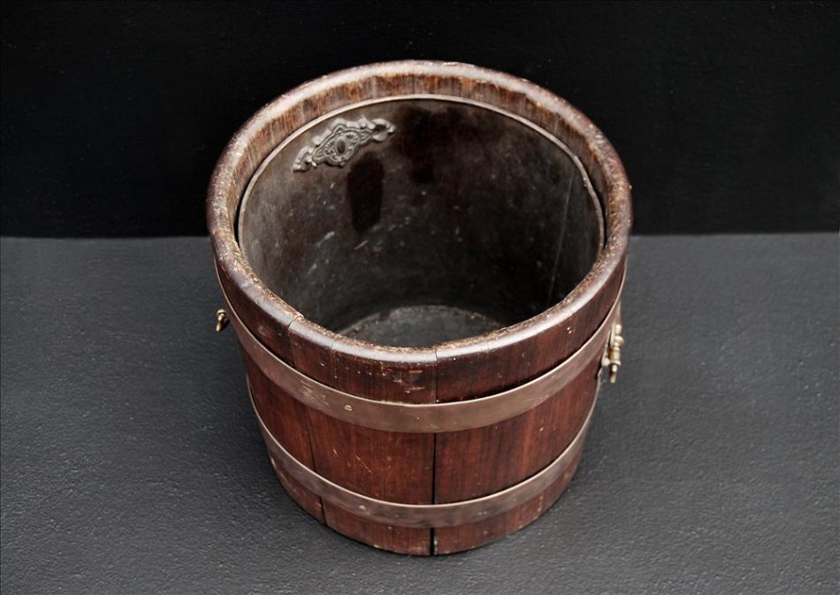 A rustic wood coal bucket