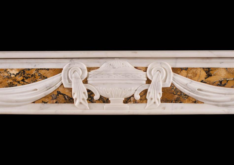 A French Louis XVI style fireplace in Statuary and Siena marble