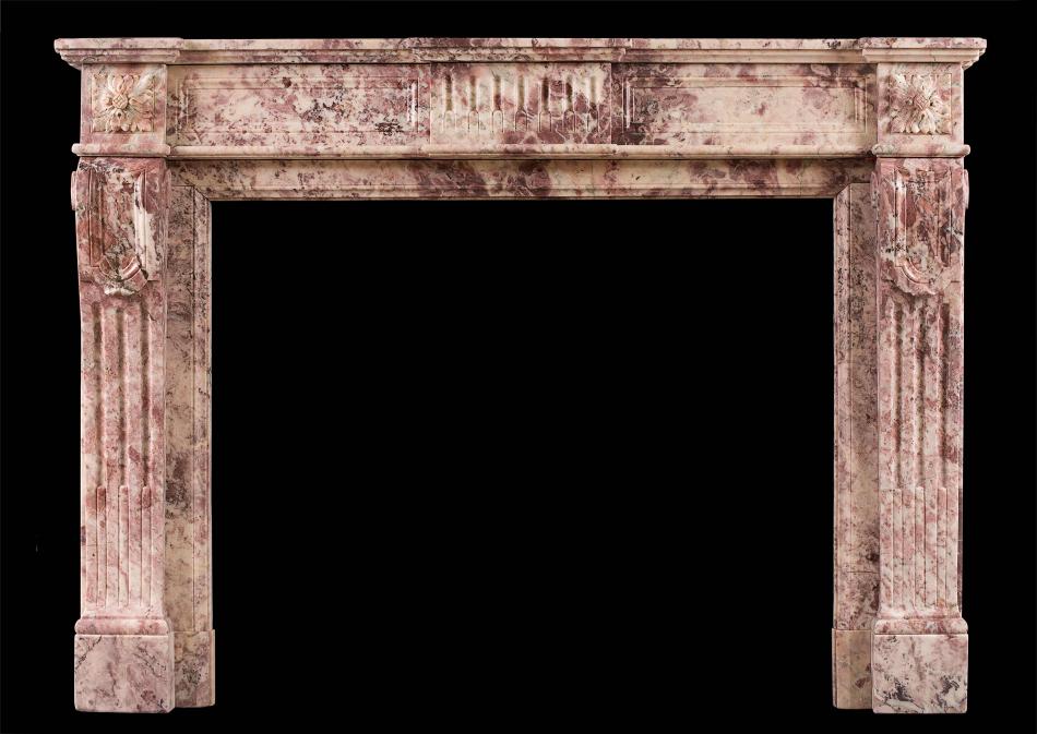 A Fior di Pesco marble Louis XVI fireplace