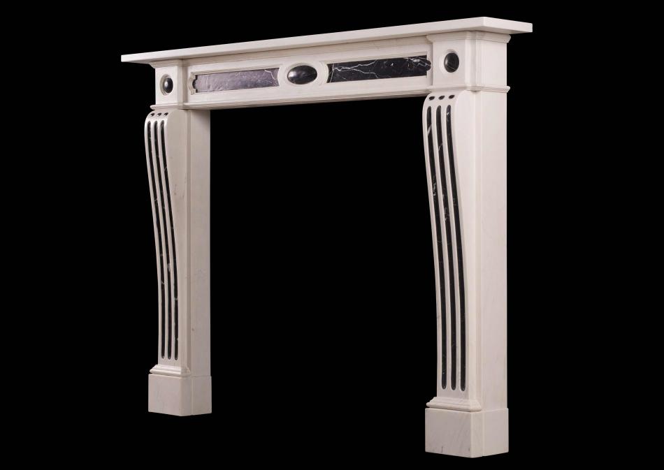 A George III style fireplace in white and black marble