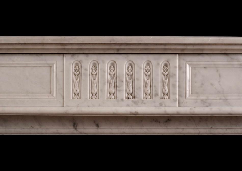A Louis XVI style fireplace in Carrara marble