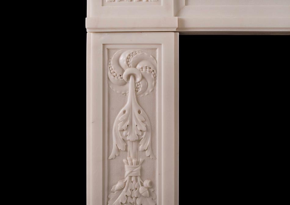A finely carved French Louis XVI antique fireplace